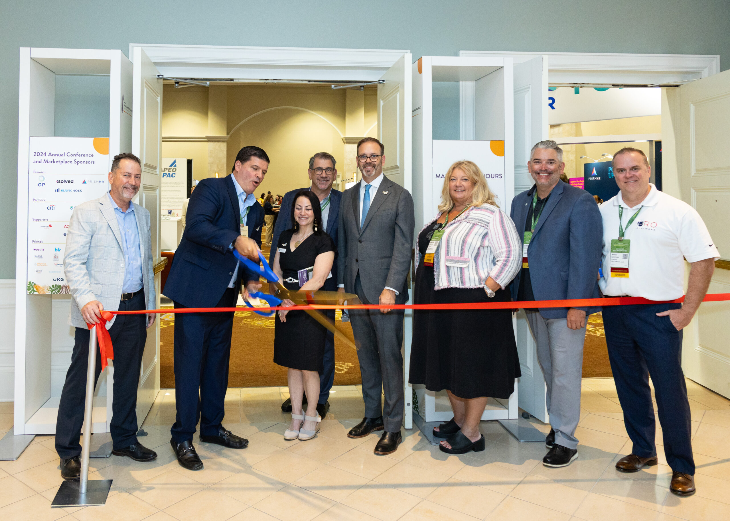 PRO Software President, Ryan Mossman, helping cut the ribbon of the 2024 NAPEO Marketplace